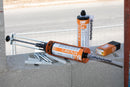 C-Mix Plus sealant gun and accessories on a concrete surface