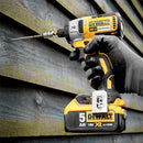DeWalt impact driver being used on wooden planks