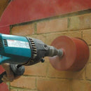 Makita 8406 on a brick wall